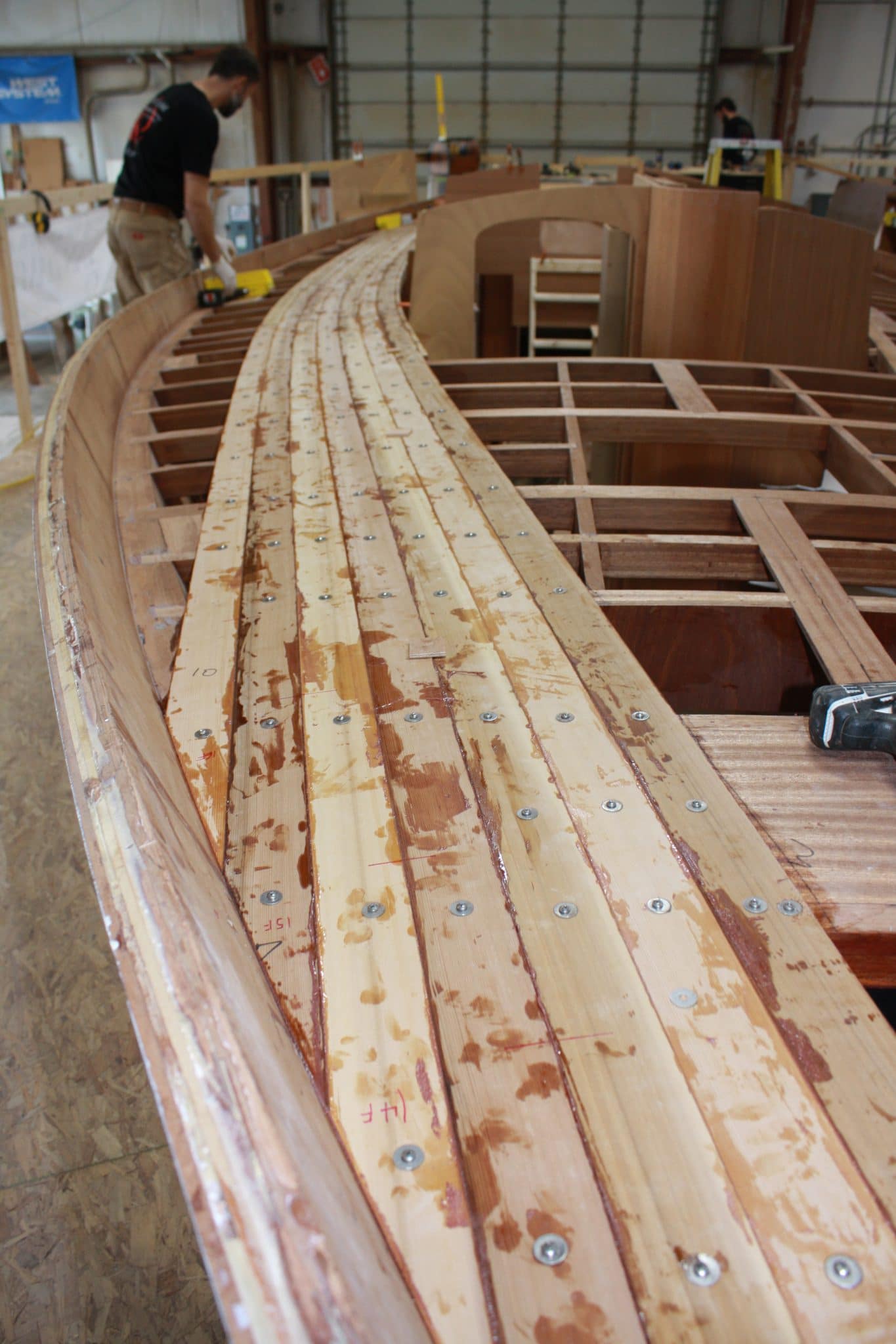 Initial deck planking being installed on Italmas